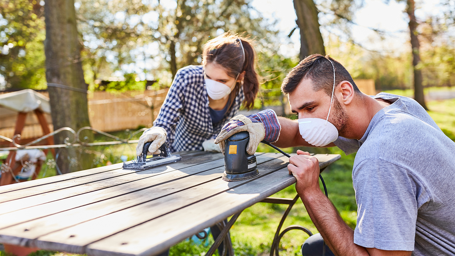 couple doing home improvement project in the garden 